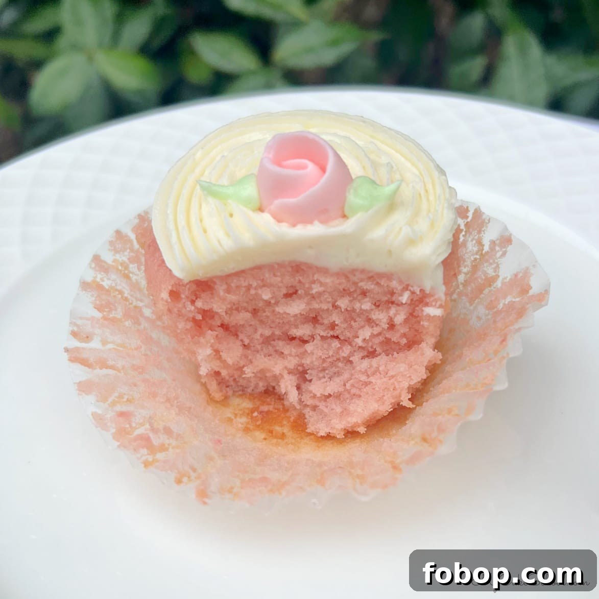 Moist Strawberry Cupcakes with Fresh Strawberry Frosting 3 Strawberry Cupcake with liner peeled away.