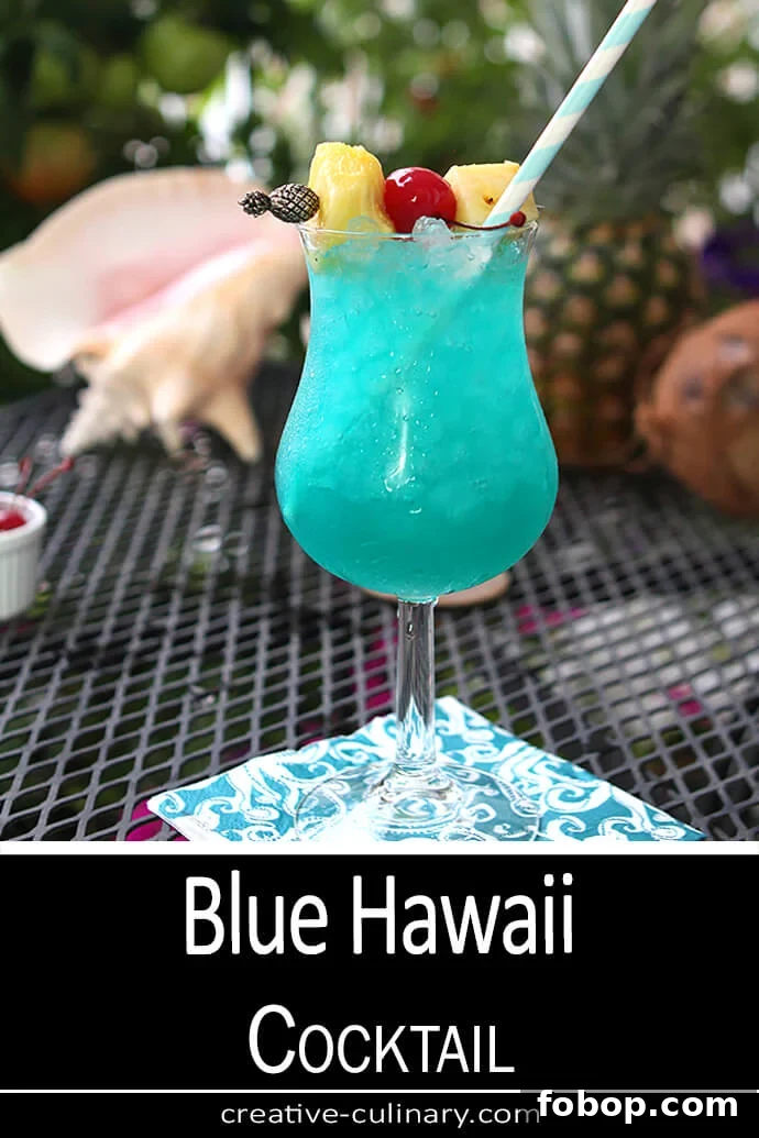Blue Hawaii Cocktail Recipe: Classic Tropical Drink Guide 6 Blue Hawaii Cocktail served in a cocktail glass with both pineapple chunks and cherries for garnish.