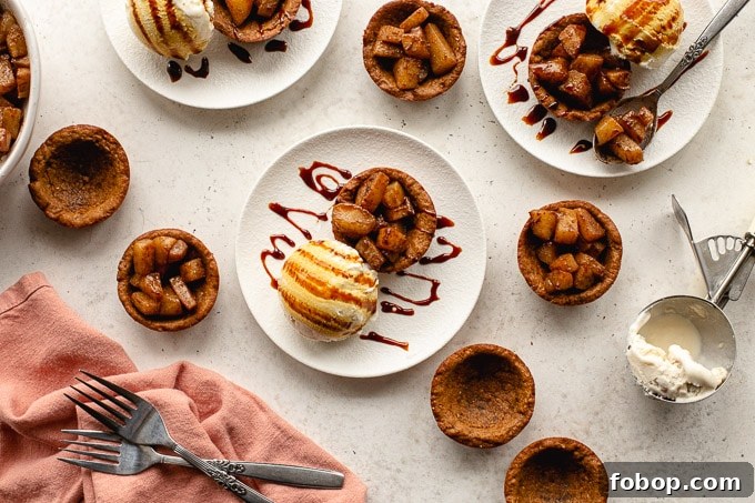 Gingerbread cups arranged on plates and filled with spiced pears.