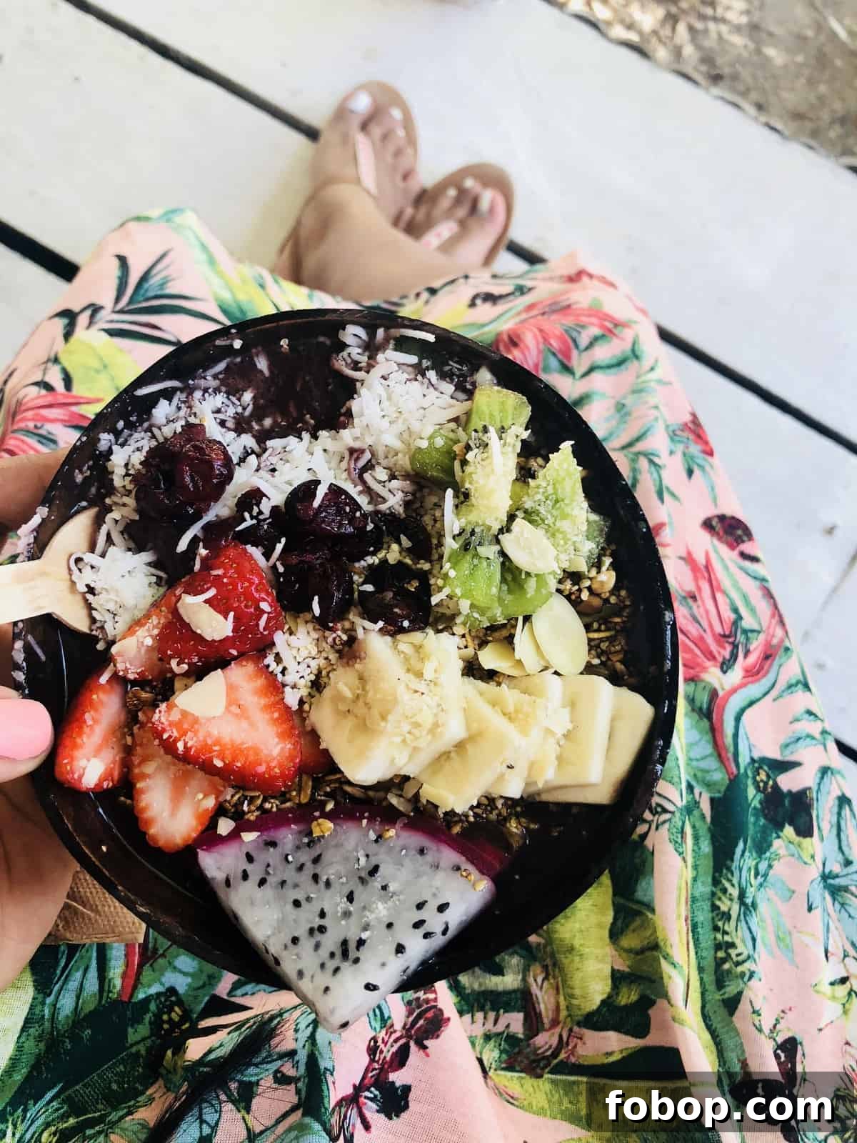 Tulum Travel Guide: Top Eats, Hotels, and Must-See Activities 4 Top down shot of a a breakfast, with chopped strawberries, kiwis and dragon fruit.