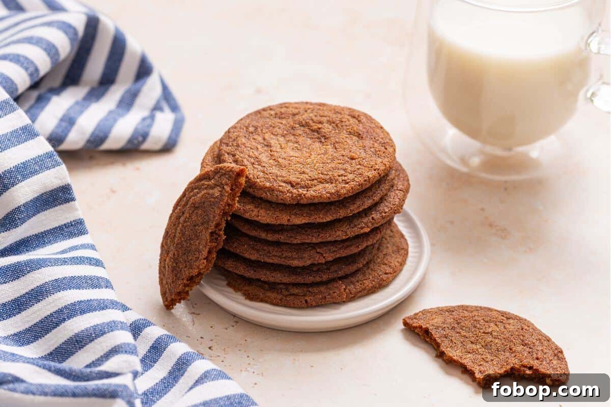 Small-Batch Brown Sugar Cookie Recipe for Perfect Soft Bites 2 A stack of cookies on a plate next to a glass of milk.