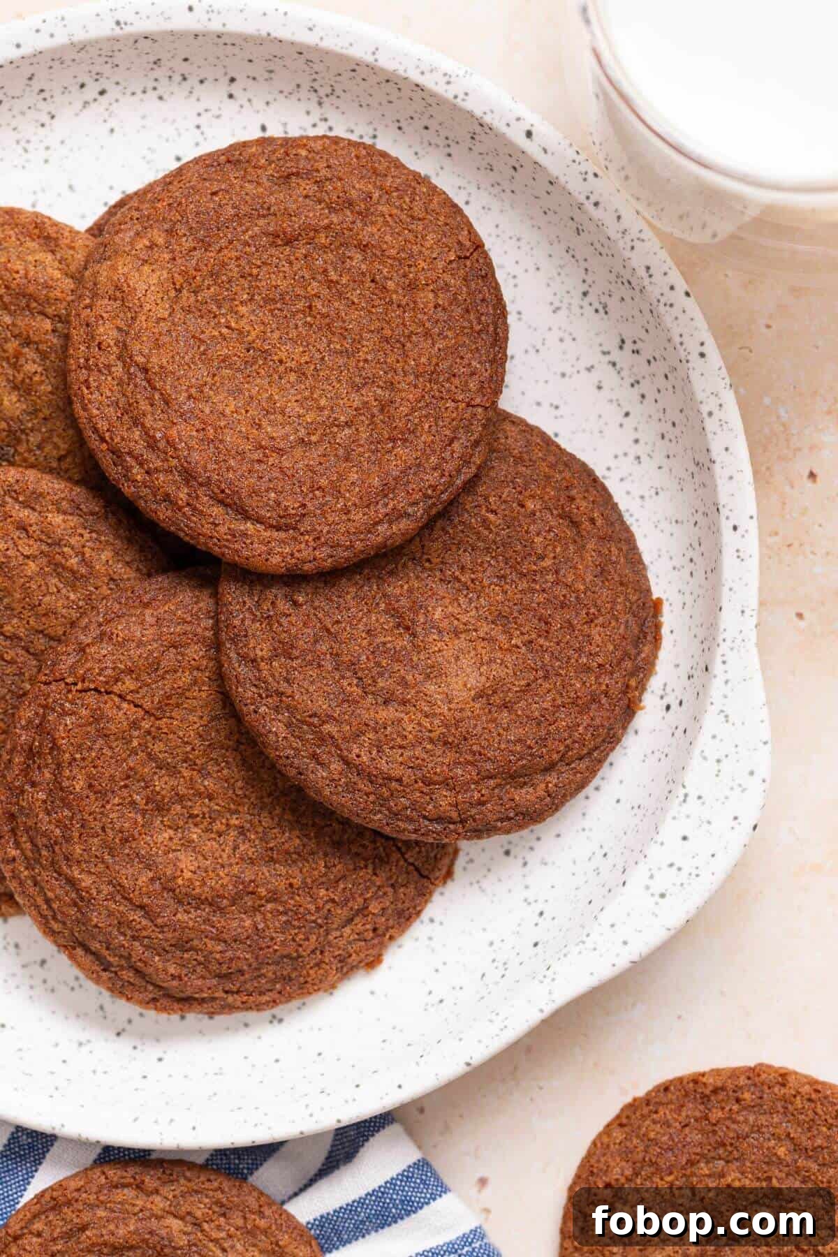 Small-Batch Brown Sugar Cookie Recipe for Perfect Soft Bites 12 Brown sugar cookies on a plate with a glass of milk.