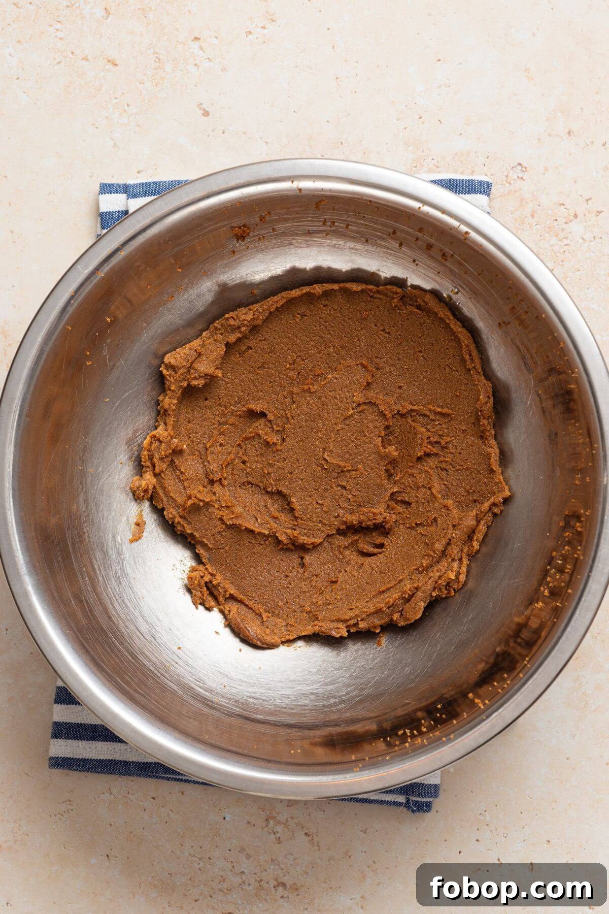 Small-Batch Brown Sugar Cookie Recipe for Perfect Soft Bites 5 A metal bowl filled with a brown sugar cookie dough mixture.