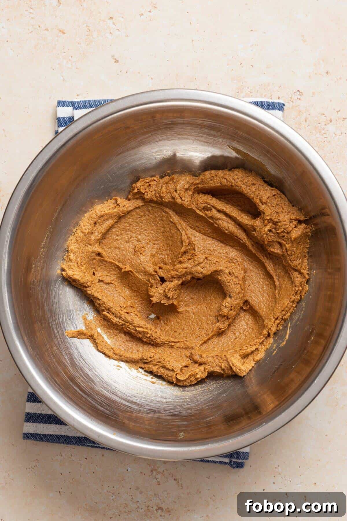 Small-Batch Brown Sugar Cookie Recipe for Perfect Soft Bites 7 Brown sugar and butter mixture in a bowl on a table.