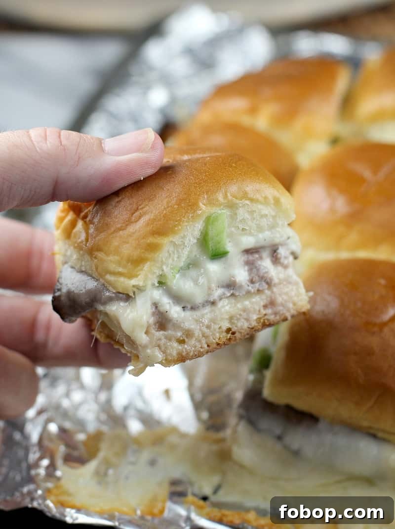 hand holding a slider; remaining sliders in the background