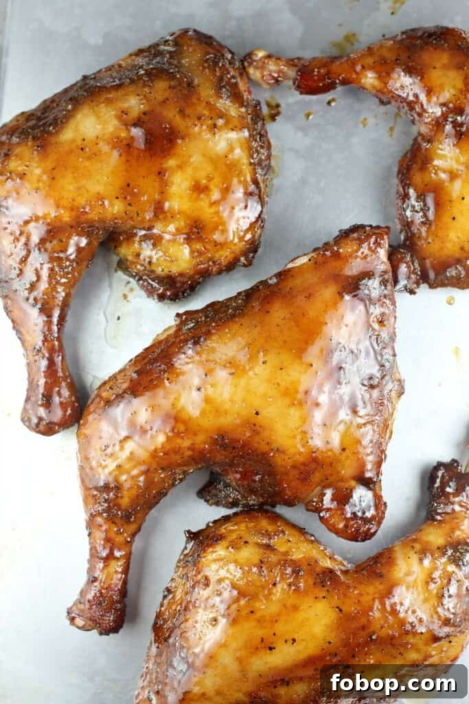 smoked chicken quarters on a bake sheet