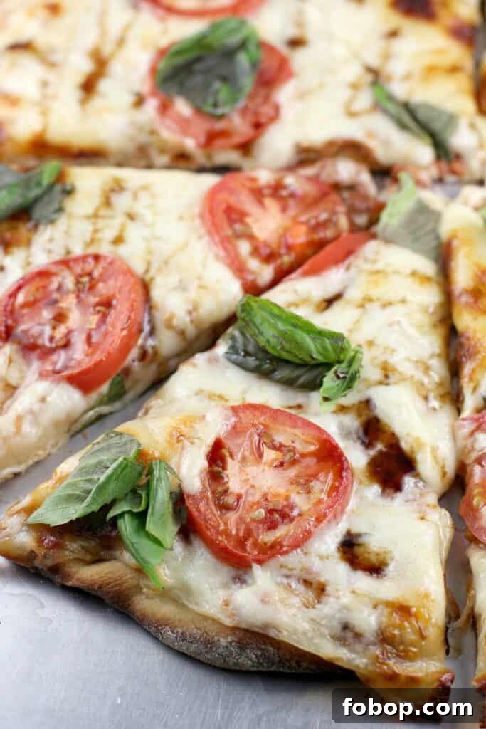 big green egg pizza margherita topped with basil and balsamic glaze