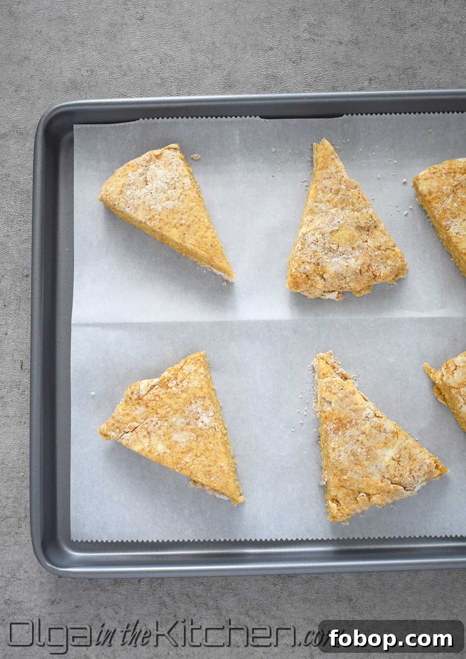 Pumpkin Scones Recipe: Flaky Autumn Scones with Warm Spices 9 Pumpkin scones on baking sheet