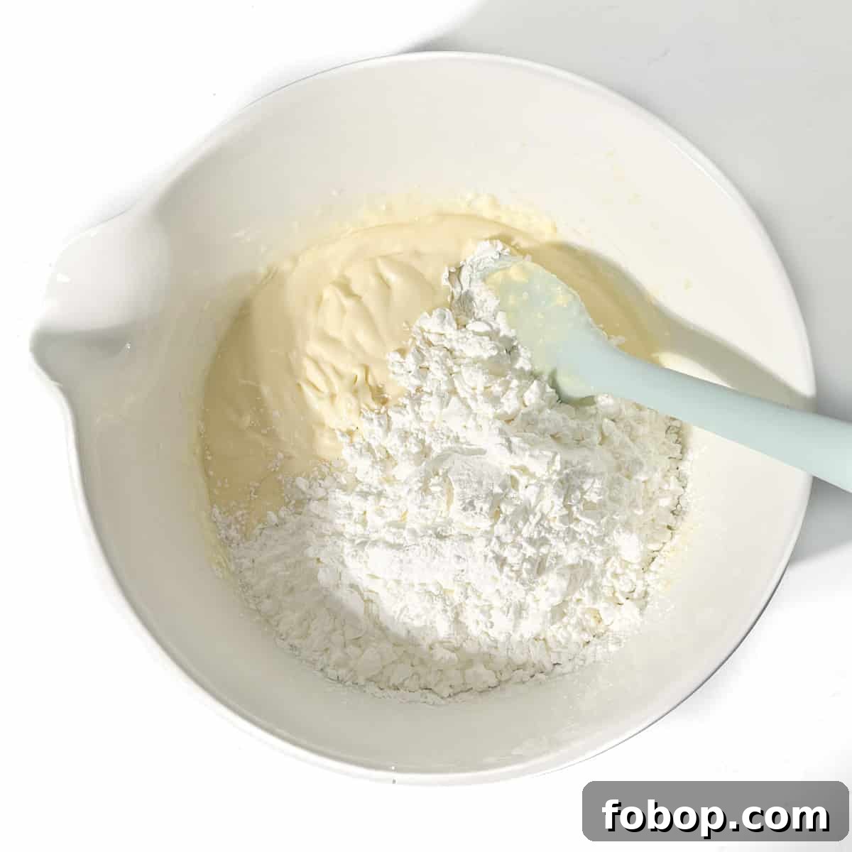 Adding more cornstarch to the sequilho dough.