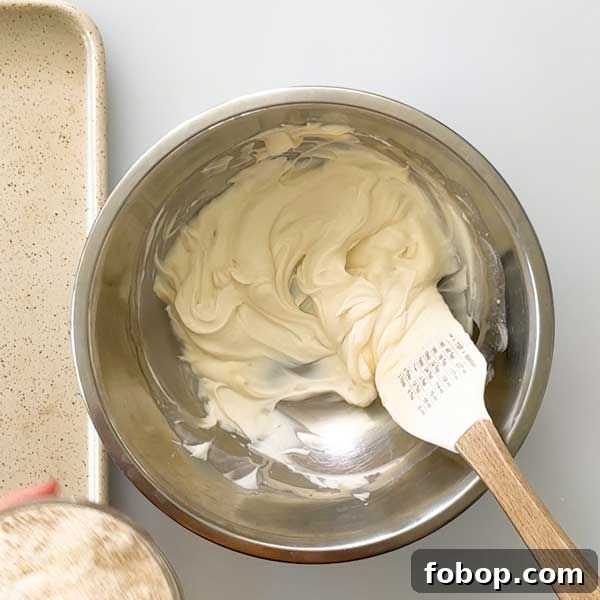 Stirring the wet ingredients for the muffin dough in a bowl.