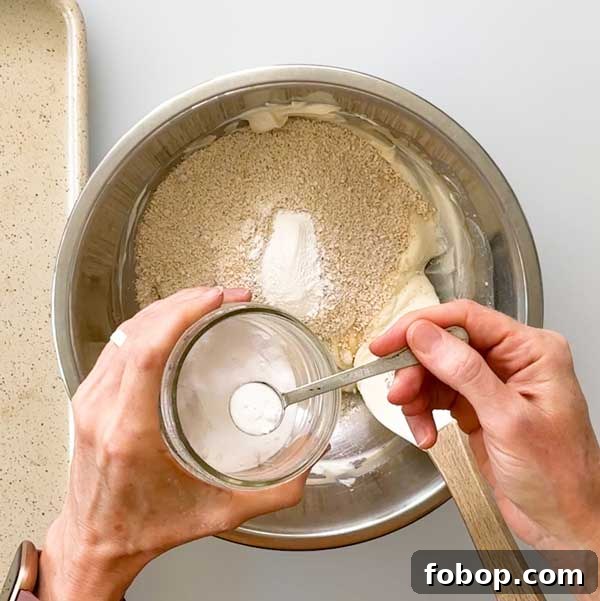 Adding the dry ingredients to the muffin dough.