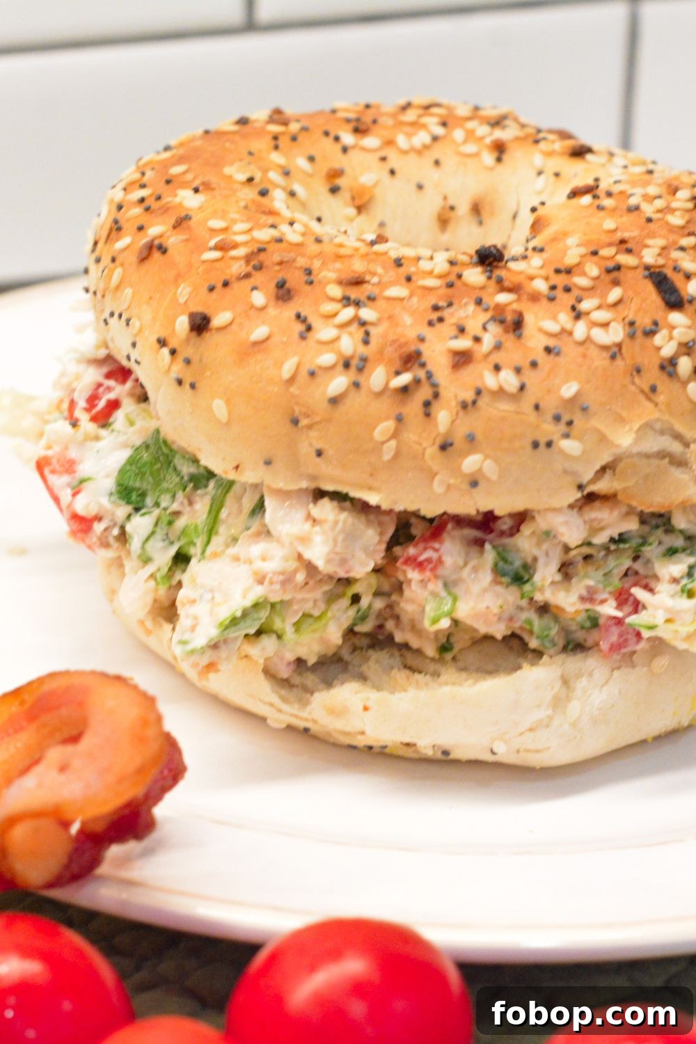 These chopped chicken bacon ranch salad bagels are the ultimate 15-minute lunch! Made with rotisserie chicken, crispy bacon, fresh tomatoes, lettuce, and ranch-seasoned cream cheese—every bite is packed with bold flavor and satisfying crunch.