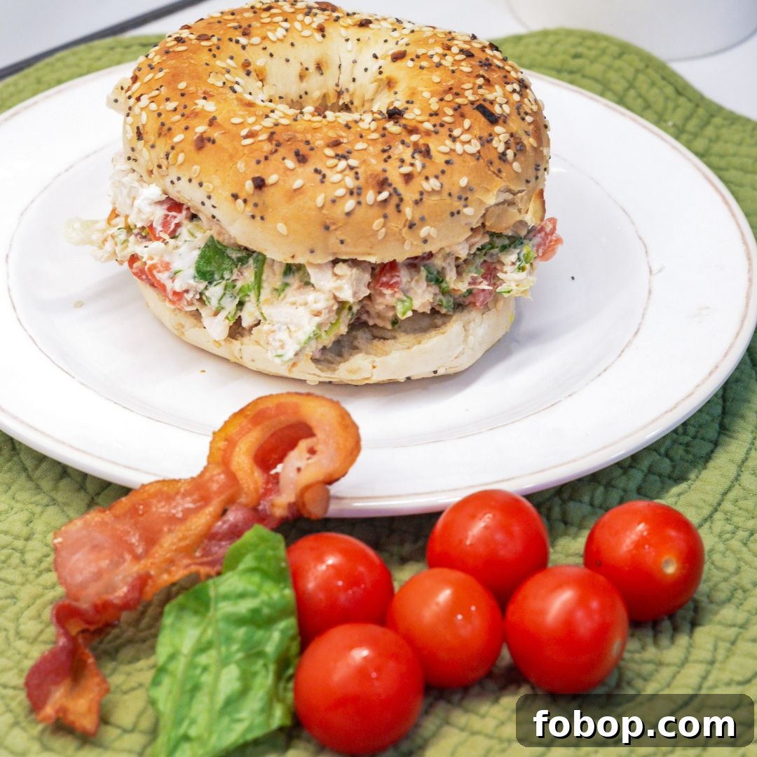 These chopped chicken bacon ranch salad bagels are a quick, no-cook lunch made with rotisserie chicken, crispy bacon, tomatoes, lettuce, and ranch cream cheese. Ready in 15 minutes!