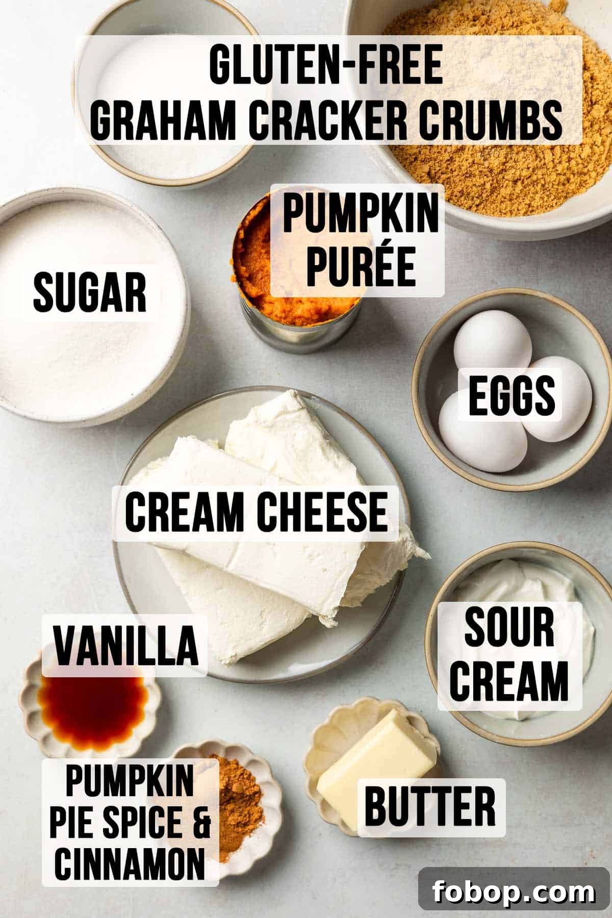 Ingredients for gluten-free pumpkin cheesecake measured out in bowls. 