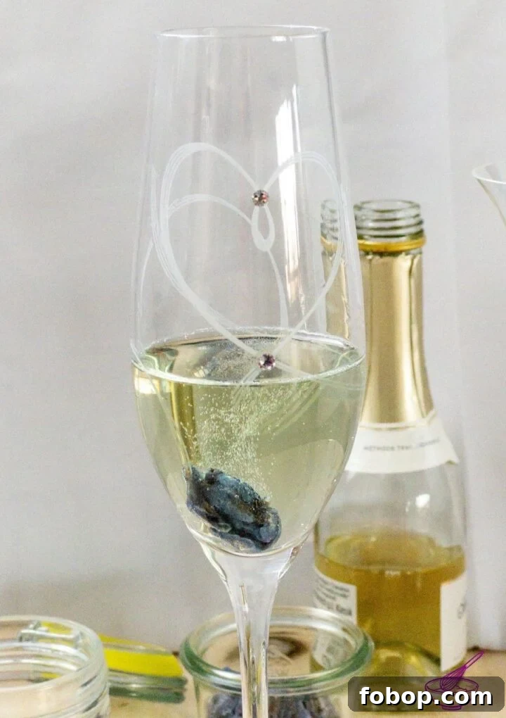Sparkling Wine–Candied Violets: Elegant Floral Dessert Recipe 2 Glass of sparkling wine with candied violet