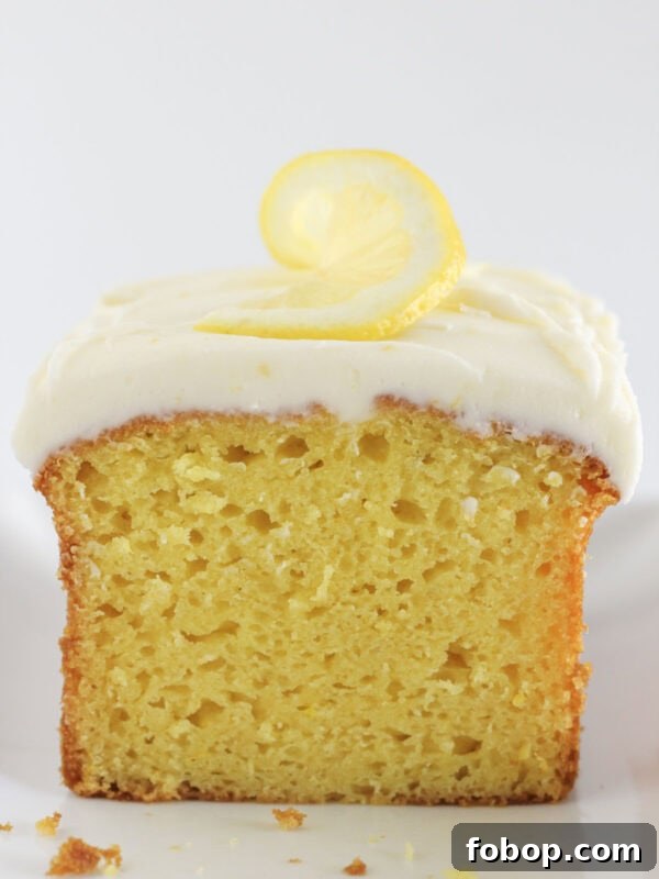 Ultimate Golden Oreo Cake Recipe: Moist, Crunchy Dessert 9 A loaf of lemon bread with frosting on top.
