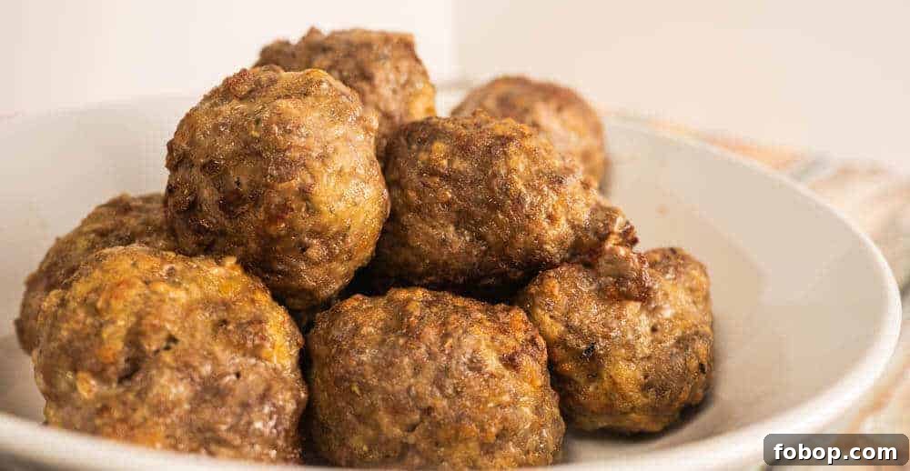 Crispy Air Fryer Meatballs in 10 Minutes: Quick Family Recipe 3 meatballs air fried and ready in a bowl.