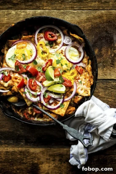 Authentic Mexican Pork Carnitas Recipe for Tender, Crispy Meat 6 A hearty Smoked Chicken Chilaquiles breakfast in cast iron with fried eggs on top waiting to be devoured