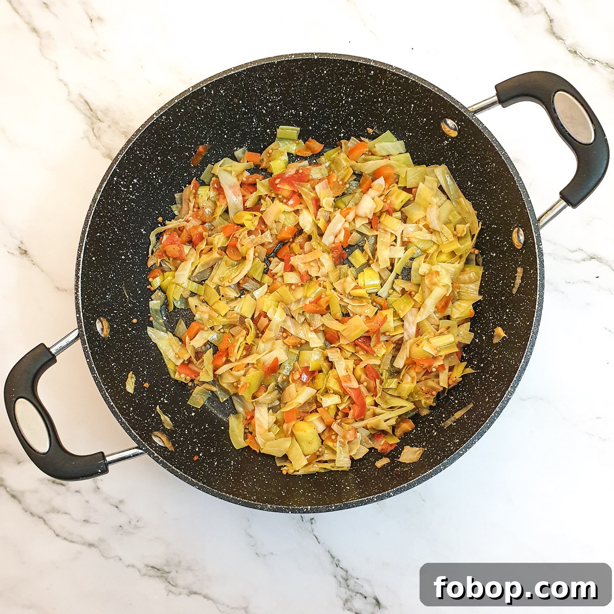 Cooked cabbage stuffing in a frying pan.