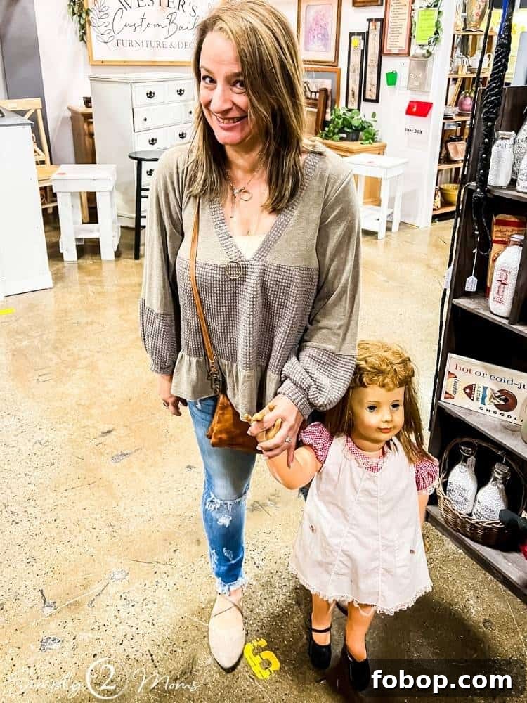 Anne holding hands with a large vintage doll