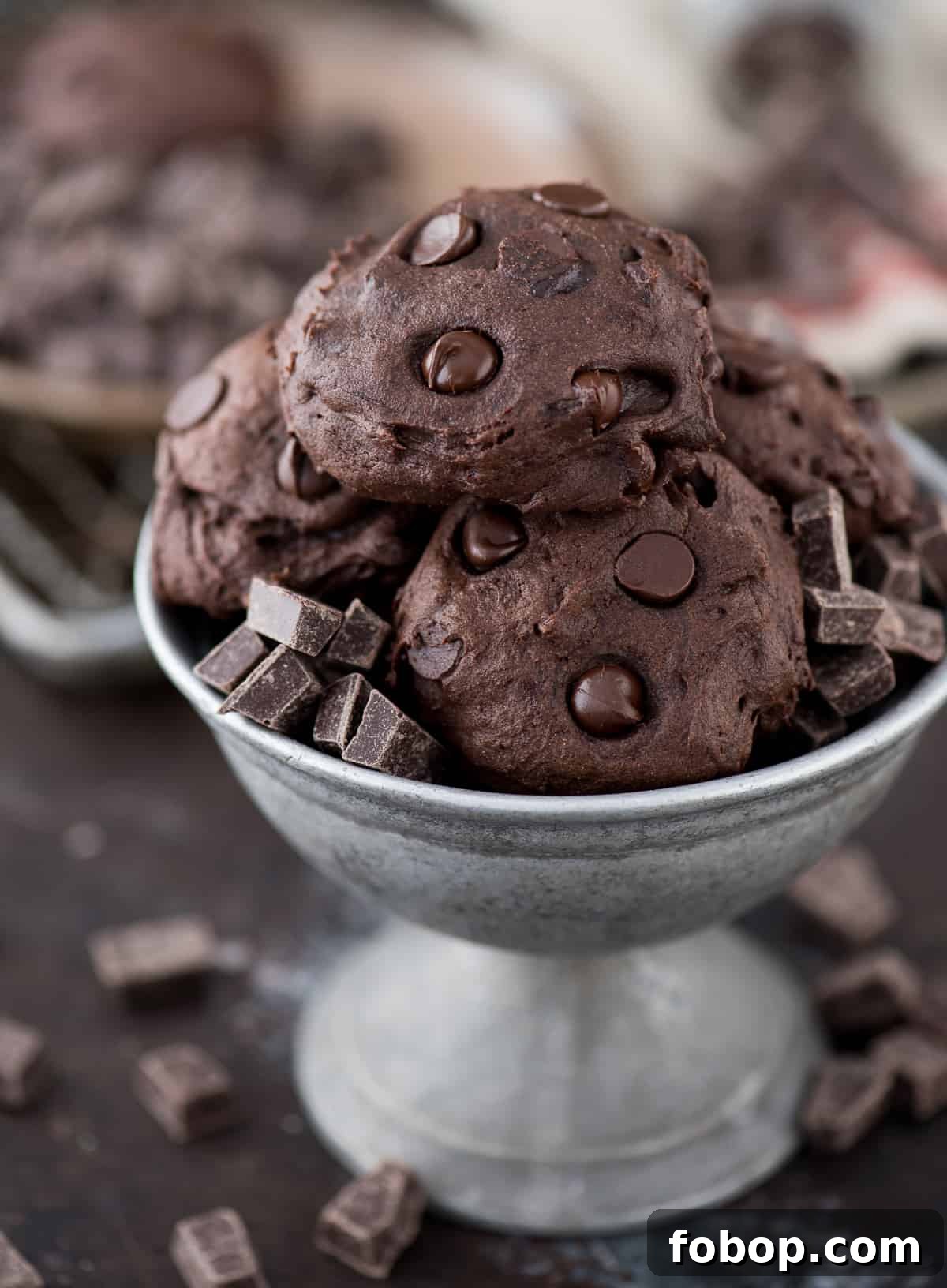 Healthier Dark Chocolate Coconut Oil Cookies Healthy dark chocolate coconut oil cookies in a bowl with small pieces of chocolate.