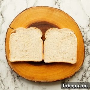 overhead shot of two slices of bread on wooden board