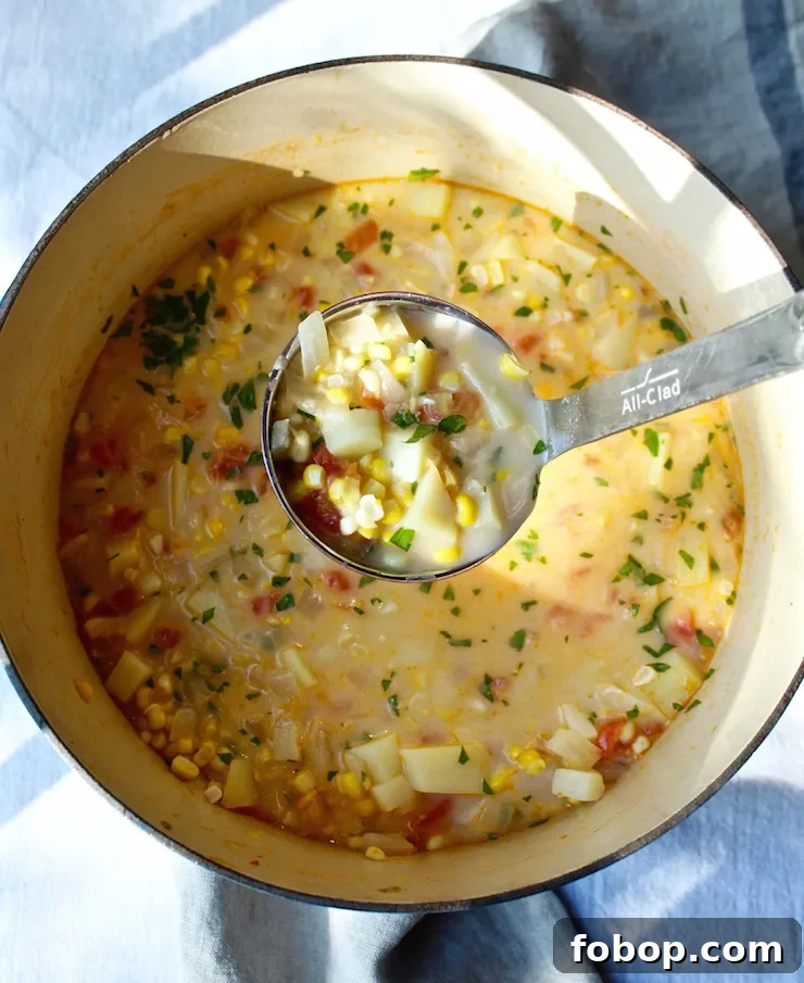 Creamy Summer Corn Chowder Recipe with Fresh Corn and Herbs 5 Summer Corn Chowder in pot with ladle