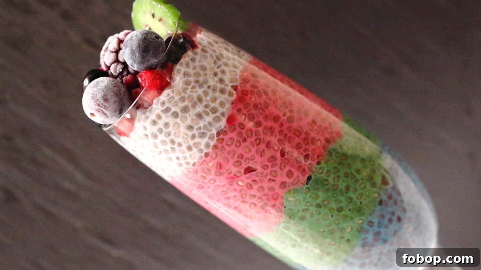 11 Irresistible Strawberry Recipes That Put Fruit Centerstage 5 Rainbow Chia Pudding with dark background in a glass.