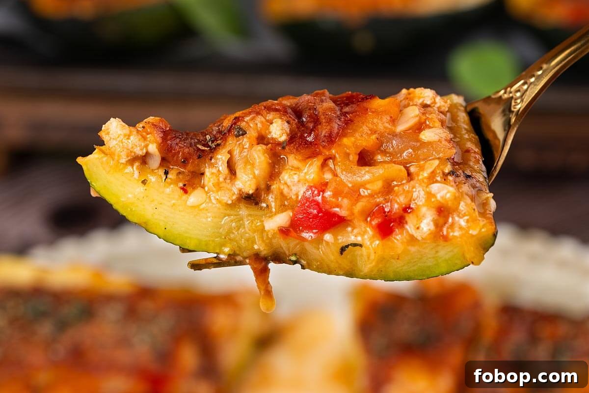 bite of stuffed zucchini on a fork.