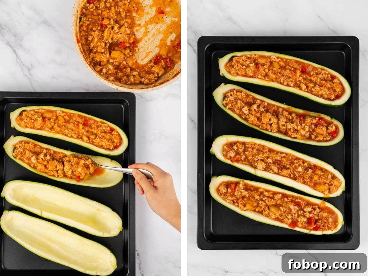 hand with spoon stuffing zucchini, 4 stuffed zucchinis.