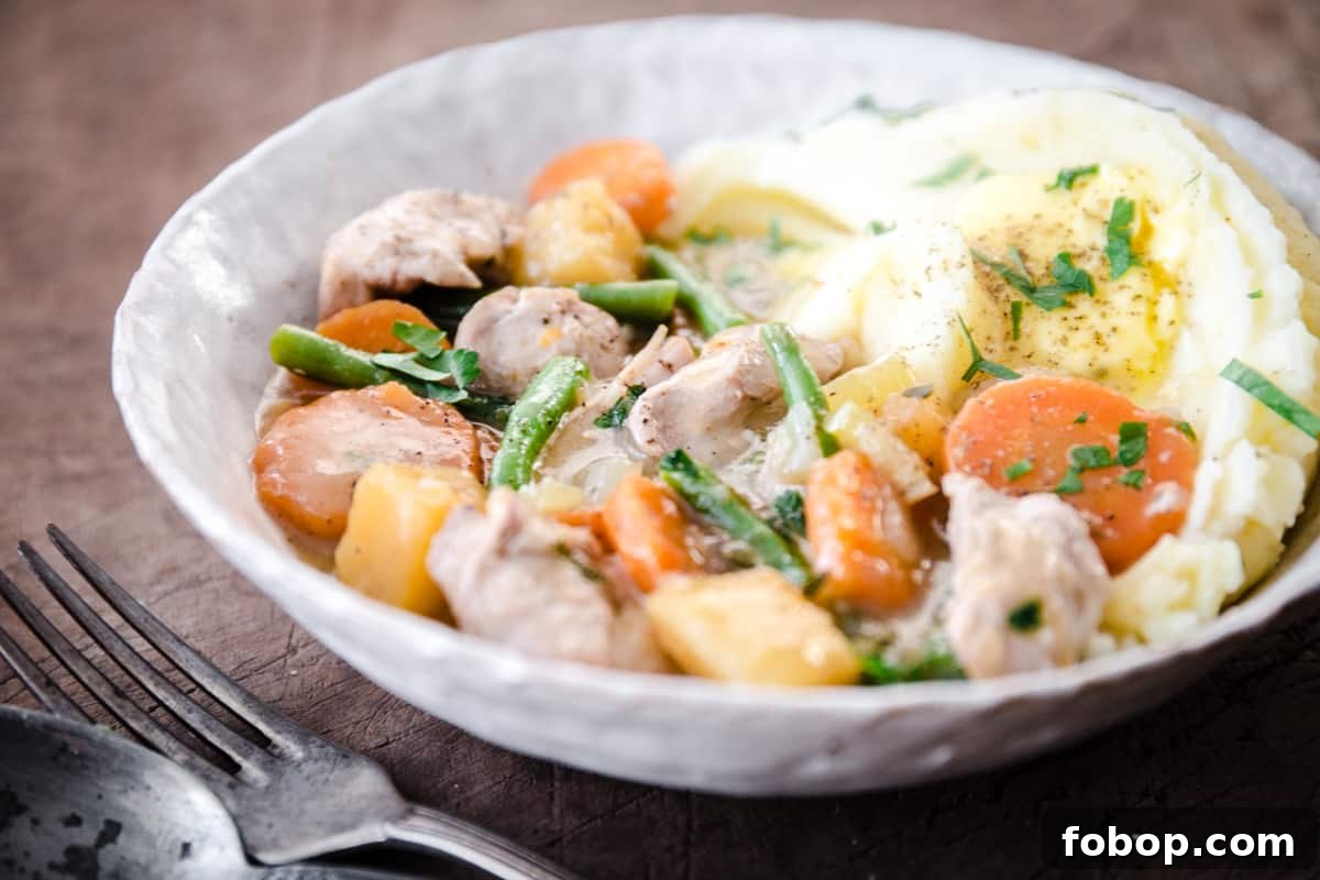 Chicken Casserole in a bowl with mashed potato