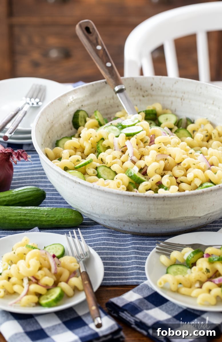 cucumber pasta salad in a bowl and served on two smaller plates.