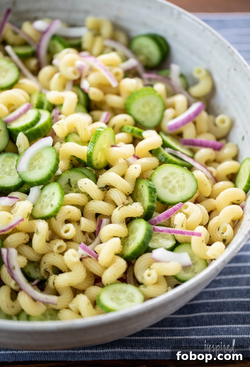 cucumber pasta salad served in a large bowl.