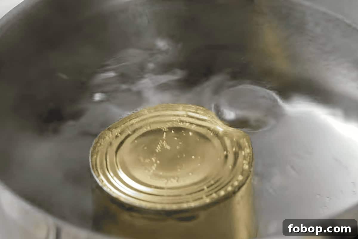 How to Make Creamy Homemade Dulce de Leche Quickly 9 boiling a can of sweetened condensed milk in a large pot.