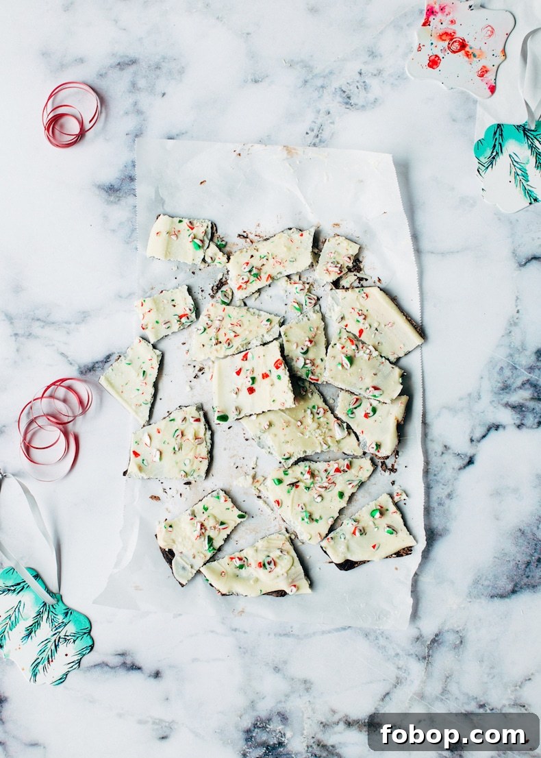 White Chocolate Candy Cane Bark for Christmas Gifts & Parties 4 christmas bark pieces on parchment