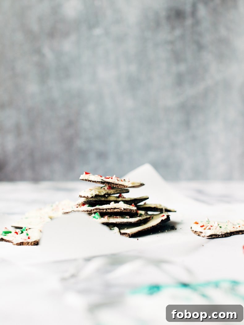 White Chocolate Candy Cane Bark for Christmas Gifts & Parties 5 candy cane bark piled high on a piece of parchment