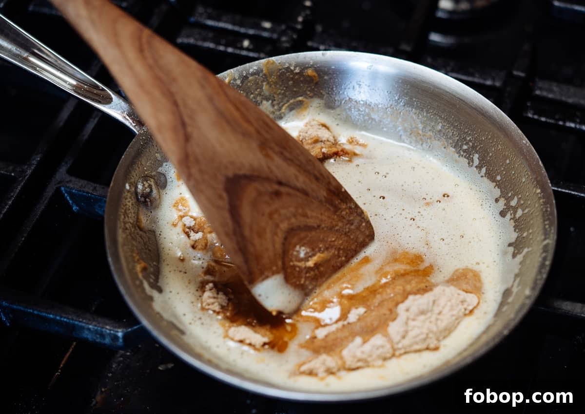 adding toasted flour to brown butter.