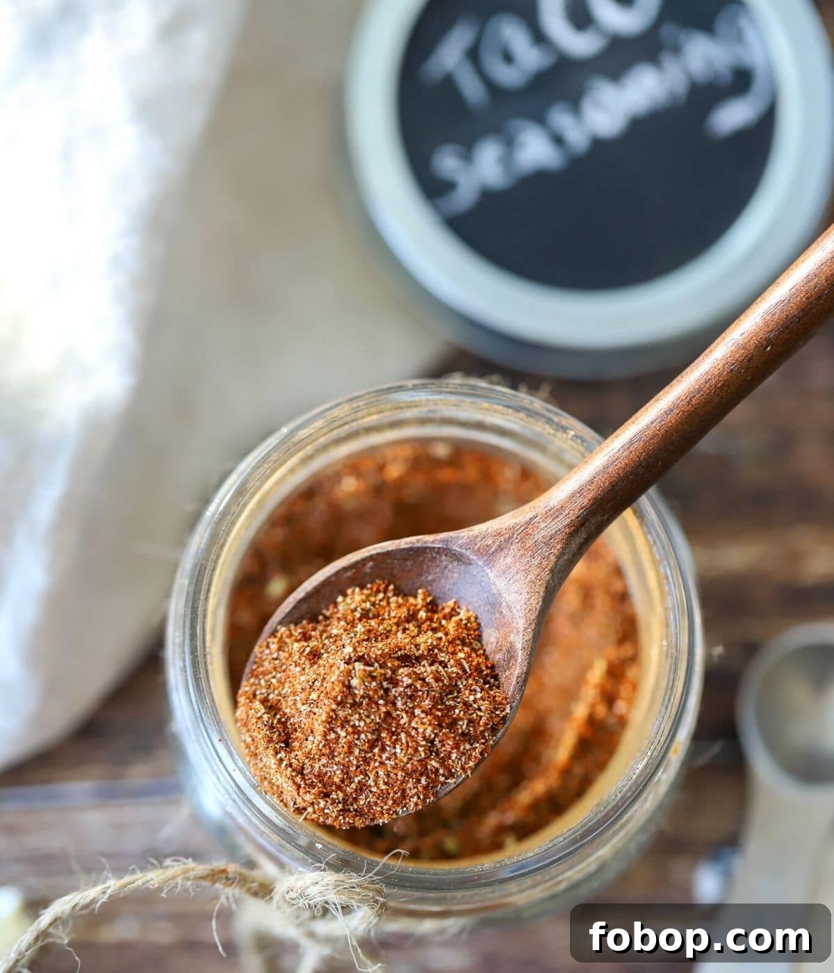 Homemade Mild Taco Seasoning Recipe for Authentic Flavor 5 taco meat seasoning with a spoon in it.
