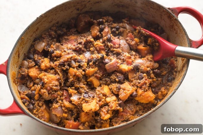 Sweet Potato and Black Bean Chili Recipe for Cozy Weeknights 7 Thick vegetarian chili in a Dutch oven, ready to serve.