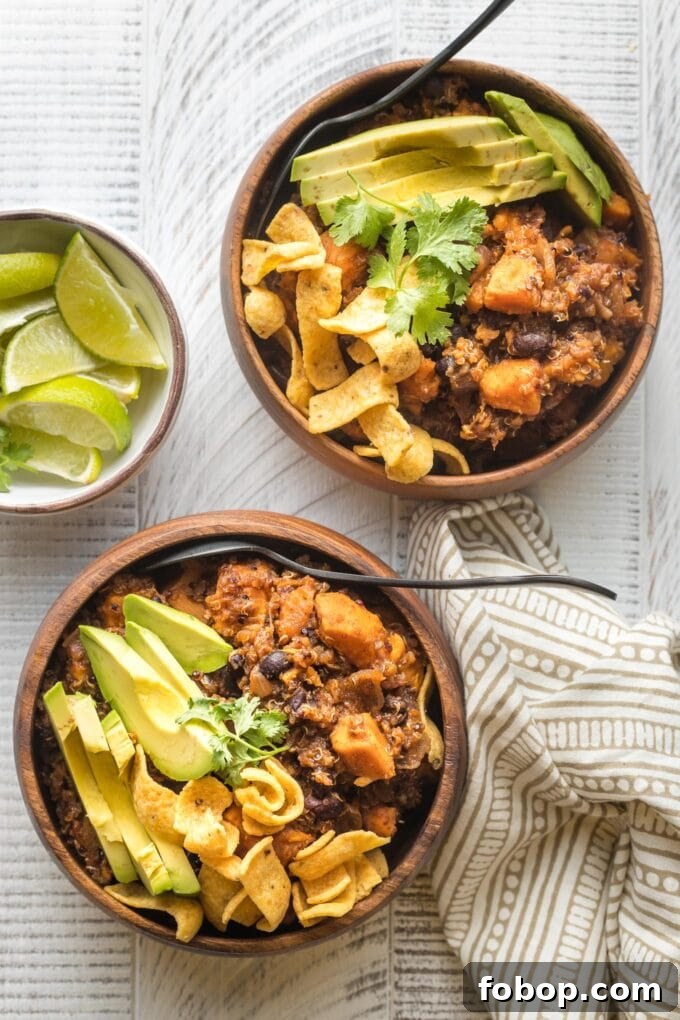 Sweet Potato and Black Bean Chili Recipe for Cozy Weeknights 9 Two bowls of sweet potato black bean chili, with spoons to dig in.