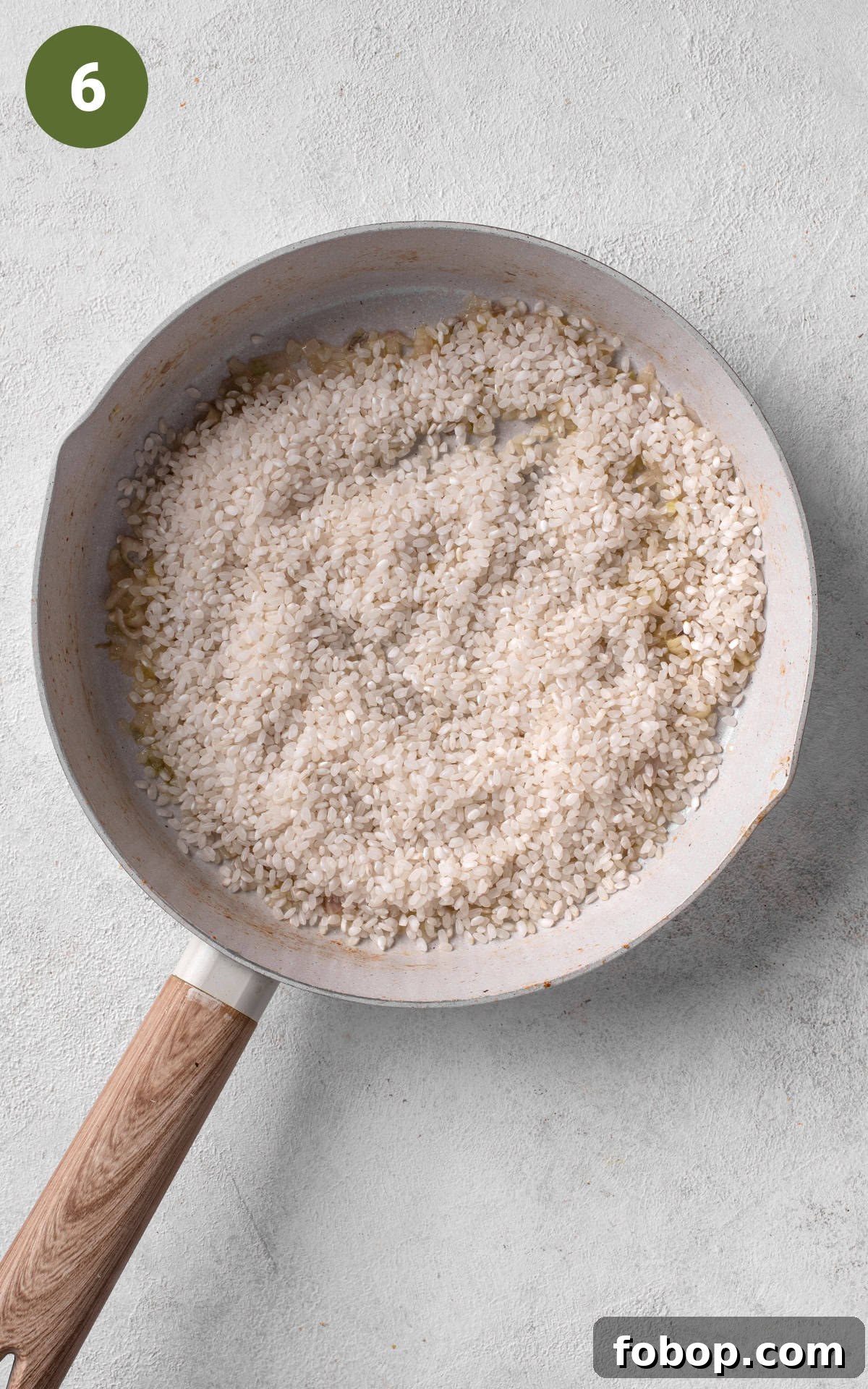 cooking rice in a skillet.