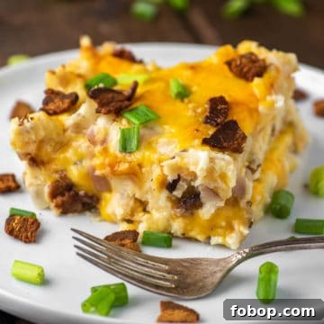 slice of pierogi lasagna on white plate with fork