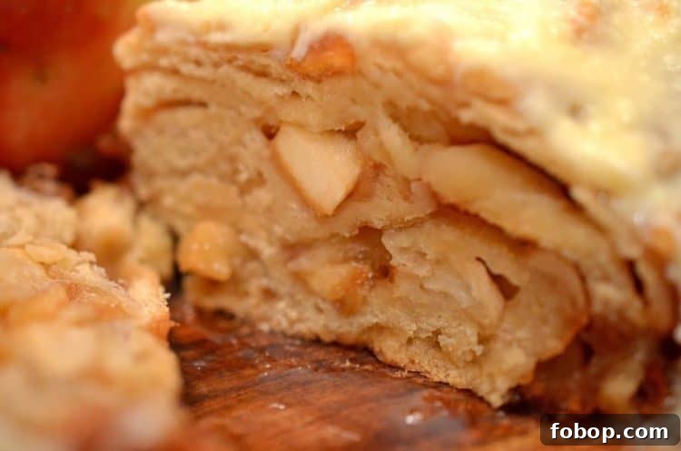A close up of a cross section of apple bread,