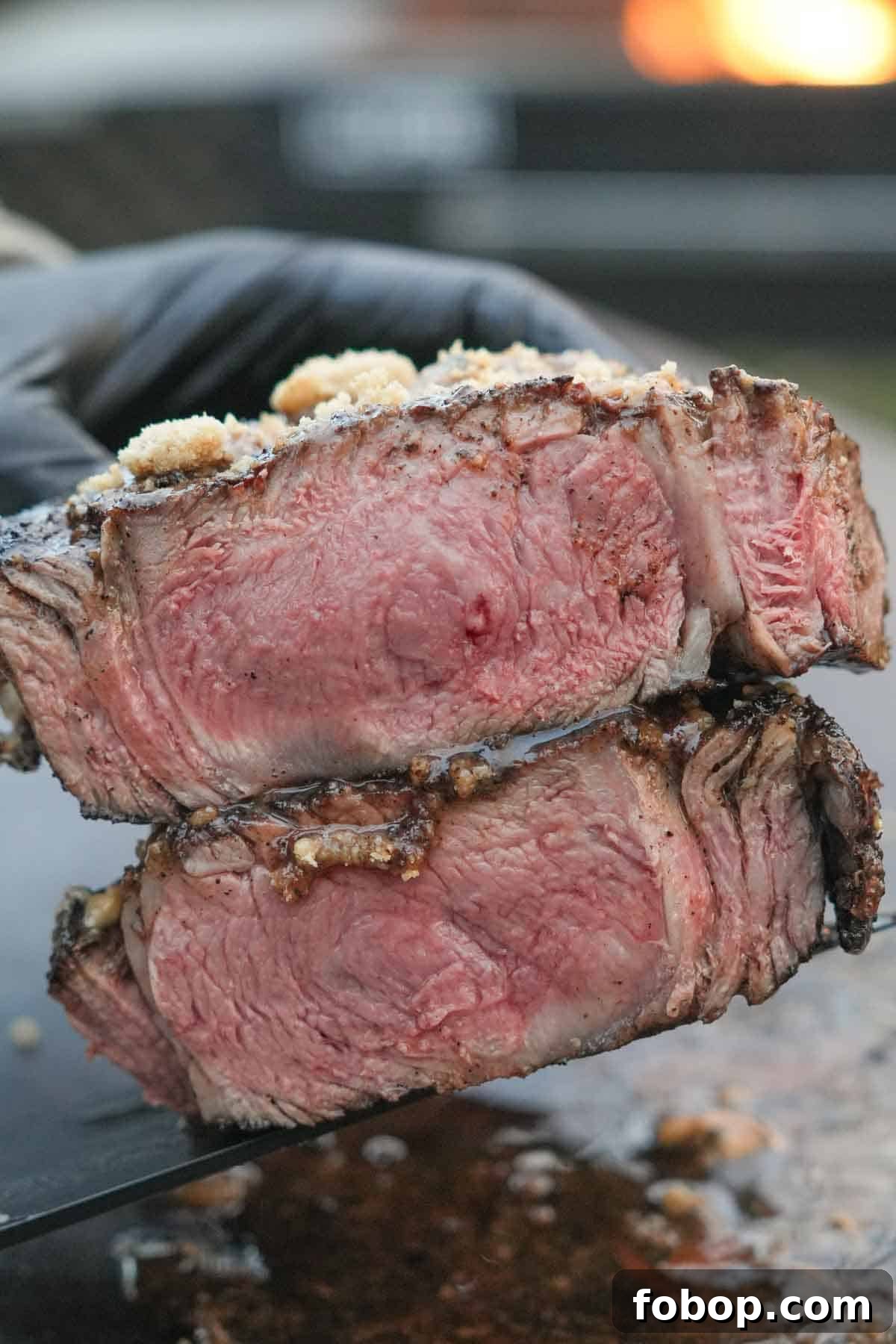 Coffee-Crusted Steak Recipe: Bold Flavor with a Perfect Seared Crust 3 Close-up of the coffee-crusted ribeye steak, cut in half, slathered in the cookie butter.