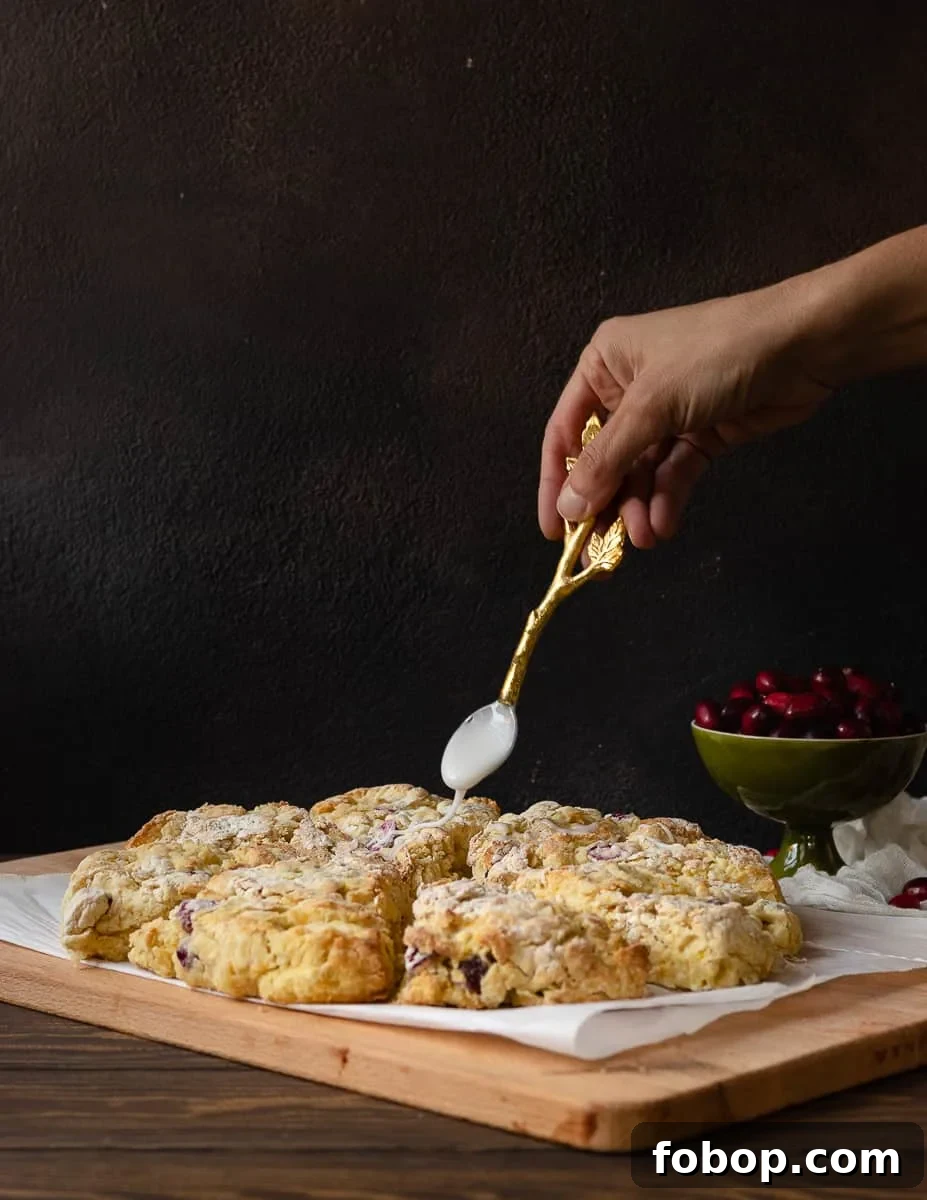 Cranberry Orange Scones with Zesty Glaze 3 Keep winter breakfast bright with these flavorful fresh cranberry orange scones! Make the dough ahead and freeze, or mix and bake in under an hour. This easy buttermilk scone recipe is a great way to use fresh cranberries! * Recipe on GoodieGodmother.com