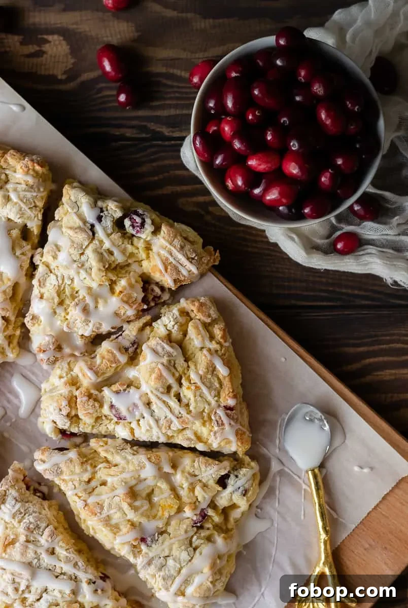 Cranberry Orange Scones with Zesty Glaze 4 Keep winter breakfast bright with these flavorful fresh cranberry orange scones! Make the dough ahead and freeze, or mix and bake in under an hour. This easy buttermilk scone recipe is a great way to use fresh cranberries! * Recipe on GoodieGodmother.com