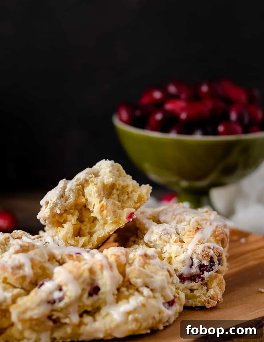 Cranberry Orange Scones with Zesty Glaze 5 Keep winter breakfast bright with these flavorful fresh cranberry orange scones! Make the dough ahead and freeze, or mix and bake in under an hour. This easy buttermilk scone recipe is a great way to use fresh cranberries! * Recipe on GoodieGodmother.com