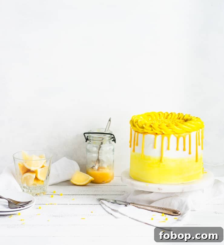 cake with a jar of lemons and lemon curd in the background