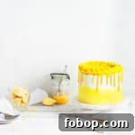 cake with a jar of lemons and lemon curd in the background