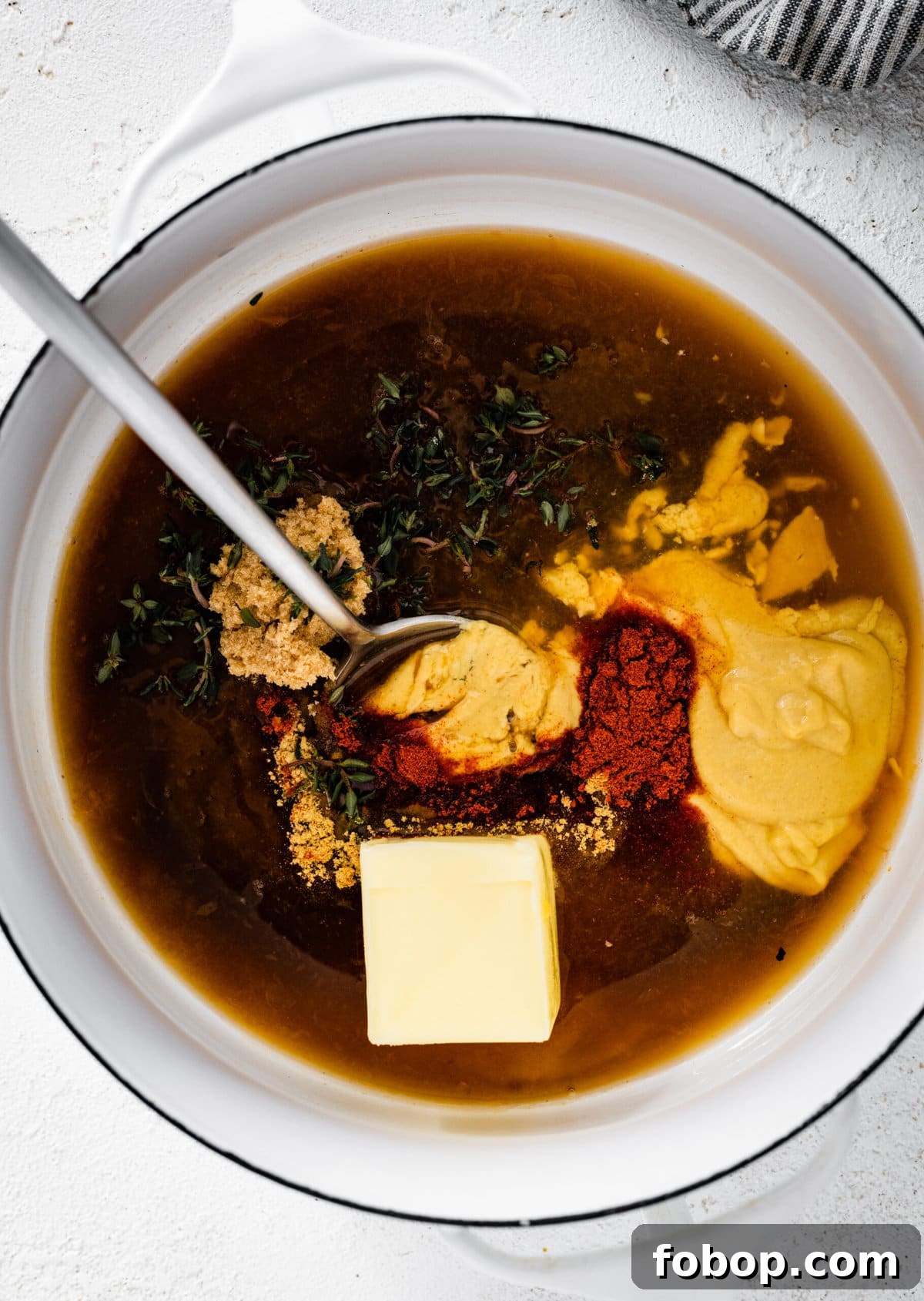 Ham glaze ingredients added to a saucepan.